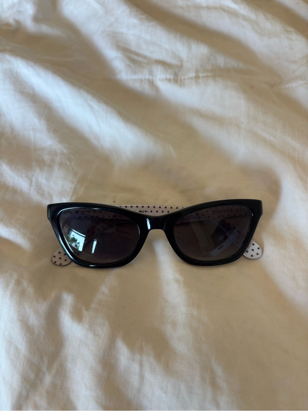 Kate Spade New York Black Cat-Eye Sunglasses with Polka Dot Temples